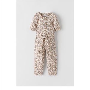 BELTED FLORAL JUMPSUIT